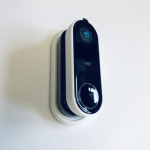 White wall plate black wedge with Nest Hello